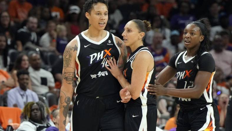 May 21, 2023; Phoenix, Arizona, USA; Phoenix Mercury guard Diana Taurasi (3) holds back Phoenix Mercury center Brittney Griner (42) after a foul call in the second half against the Chicago Sky at Footprint Center. Mandatory Credit: Rick Scuteri-USA TODAY Sports