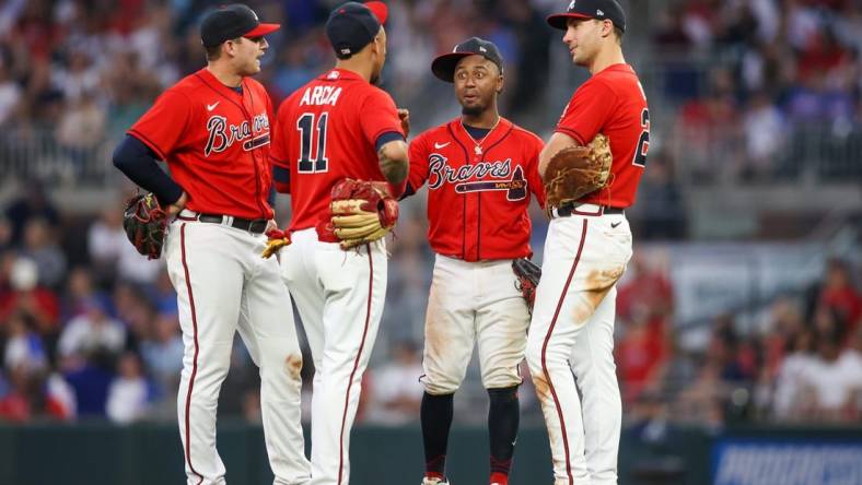 May 26, 2023; Atlanta, Georgia, USA; Atlanta Braves third baseman Austin Riley (27) and shortstop Orlando Arcia (11) and second baseman Ozzie Albies (1) and first baseman Matt Olson (28) talk during a pitching change against the Philadelphia Phillies in the sixth inning at Truist Park. Mandatory Credit: Brett Davis-USA TODAY Sports