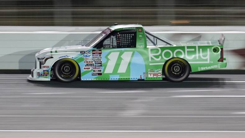 May 26, 2023; Concord, North Carolina, USA; NASCAR Craftsman Truck Series driver Corey Heim (11) during the North Carolina Education Lottery 200 at Charlotte Motor Speedway. Mandatory Credit: Jim Dedmon-USA TODAY Sports