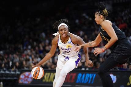 May 27, 2023; Las Vegas, Nevada, USA; Los Angeles Sparks forward Nneka Ogwumike (30) dribbles the ball against Las Vegas Aces forward/center Candace Parker (3) during the third quarter at Michelob Ultra Arena. Mandatory Credit: Lucas Peltier-USA TODAY Sports