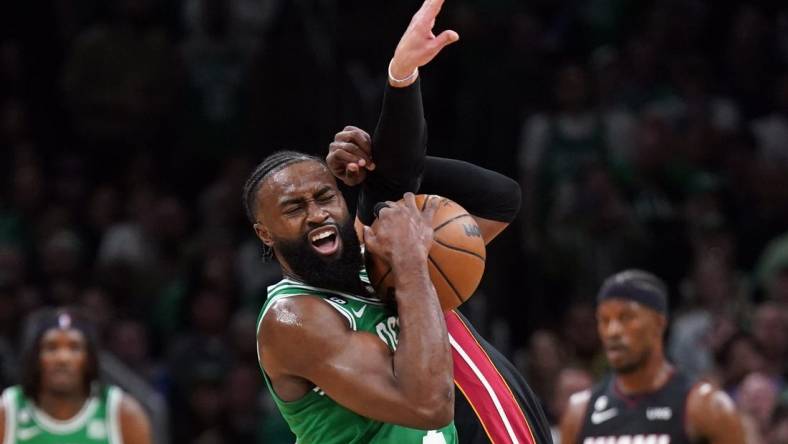 May 29, 2023; Boston, Massachusetts, USA; Boston Celtics guard Jaylen Brown (7) battles for control against Miami Heat guard Max Strus (31) in the first quarter during game seven of the Eastern Conference Finals for the 2023 NBA playoffs at TD Garden. Mandatory Credit: David Butler II-USA TODAY Sports