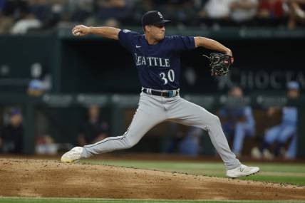 Jun 4, 2023; Arlington, Texas, USA; Seattle Mariners relief pitcher Trevor Gott (30) throws a pitch against the Seattle Mariners in the sixth inning at Globe Life Field. Mandatory Credit: Tim Heitman-USA TODAY Sports