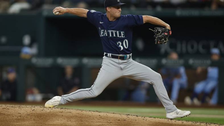 Jun 4, 2023; Arlington, Texas, USA; Seattle Mariners relief pitcher Trevor Gott (30) throws a pitch against the Seattle Mariners in the sixth inning at Globe Life Field. Mandatory Credit: Tim Heitman-USA TODAY Sports