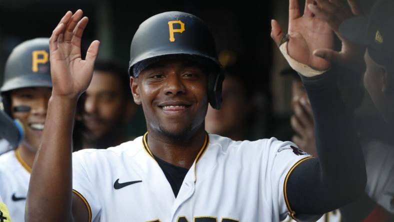 Jun 9, 2023; Pittsburgh, Pennsylvania, USA;  Pittsburgh Pirates third baseman Ke'Bryan Hayes (13) high-fives in the dugout after scoring a run against the New York Mets during the second inning at PNC Park. Mandatory Credit: Charles LeClaire-USA TODAY Sports