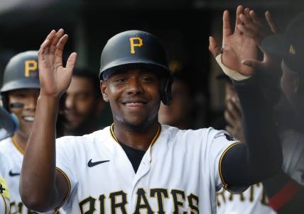Jun 9, 2023; Pittsburgh, Pennsylvania, USA;  Pittsburgh Pirates third baseman Ke'Bryan Hayes (13) high-fives in the dugout after scoring a run against the New York Mets during the second inning at PNC Park. Mandatory Credit: Charles LeClaire-USA TODAY Sports