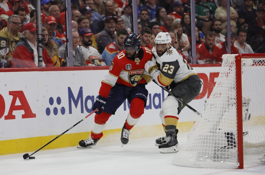 June 10, 2023; Sunrise, FL, USA; Florida Panthers left wing Anthony Duclair (10) battles for the puck against Vegas Golden Knights defenseman Alec Martinez (23) in the second period in game four of the 2023 Stanley Cup Final at FLA Live Arena. Mandatory Credit: Sam Navarro-USA TODAY Sports