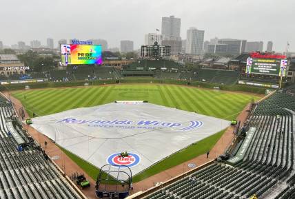 Jun 13, 2023; Chicago, Illinois, USA; A tarp sits on the field. The game between the Chicago Cubs and the Pittsburgh Pirates is delayed due to rain at Wrigley Field. Mandatory Credit: David Banks-USA TODAY Sports