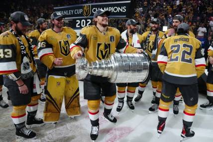 Jun 13, 2023; Las Vegas, Nevada, USA; Vegas Golden Knights forward Brett Howden (21) hoists the Stanley Cup after defeating the Florida Panthers in game five of the 2023 Stanley Cup Final at T-Mobile Arena. Mandatory Credit: Stephen R. Sylvanie-USA TODAY Sports