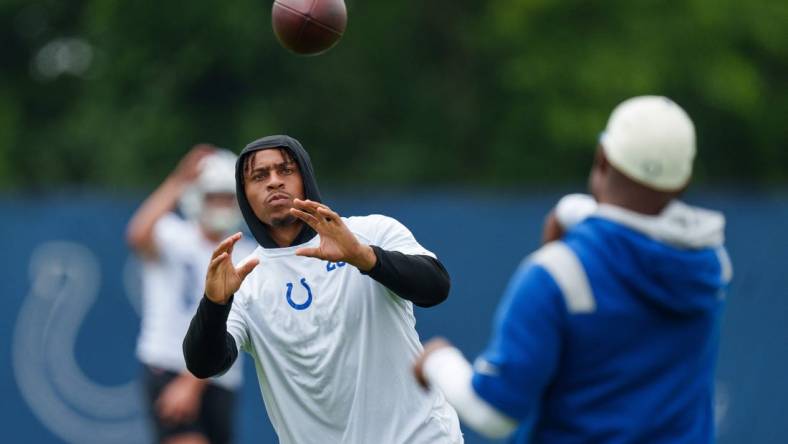 June 14, 2023; Indianapolis, IN, USA; Indianapolis Colts running back Jonathan Taylor (28) passes on the sideline Wednesday, June 14, 2023, during mandatory minicamp at the Indiana Farm Bureau Football Center in Indianapolis. Mandatory Credit: Mykal McEldowney-USA TODAY Sports