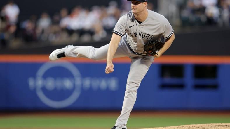 Jun 14, 2023; New York City, New York, USA; New York Yankees starting pitcher Gerrit Cole (45) follows through on a pitch against the New York Mets during the second inning at Citi Field. Mandatory Credit: Brad Penner-USA TODAY Sports