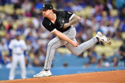 Jun 14, 2023; Los Angeles, California, USA; Chicago White Sox starting pitcher Mike Clevinger (52) throws against the Los Angeles Dodgers during the first inning at Dodger Stadium. Mandatory Credit: Gary A. Vasquez-USA TODAY Sports