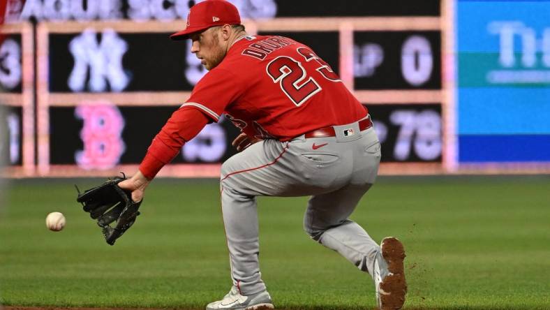 Jun 16, 2023; Kansas City, Missouri, USA;  Los Angeles Angels second baseman Brandon Drury (23) fields a ground ball in the ninth inning against the Kansas City Royals at Kauffman Stadium. Mandatory Credit: Peter Aiken-USA TODAY Sports