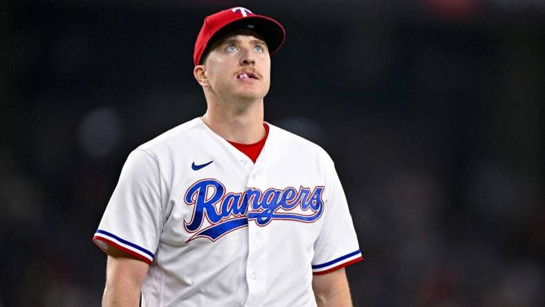 Jun 17, 2023; Arlington, Texas, USA; Texas Rangers relief pitcher Josh Sborz (66) walks off the field after pitching against the Toronto Blue Jays at Globe Life Field. Mandatory Credit: Jerome Miron-USA TODAY Sports