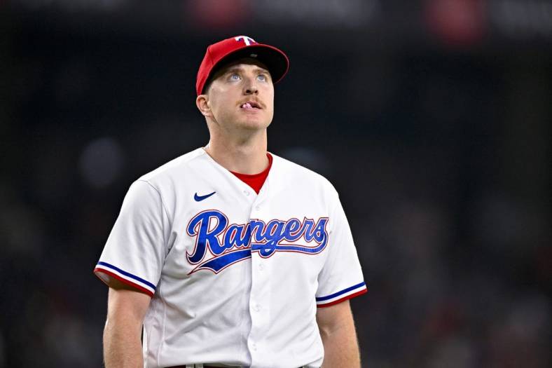 Jun 17, 2023; Arlington, Texas, USA; Texas Rangers relief pitcher Josh Sborz (66) walks off the field after pitching against the Toronto Blue Jays at Globe Life Field. Mandatory Credit: Jerome Miron-USA TODAY Sports