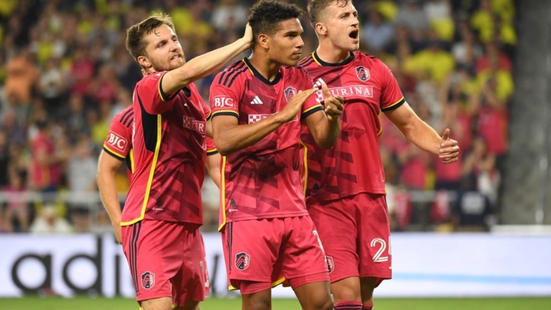 Jun 17, 2023; Nashville, Tennessee, USA; St. Louis City forward Nicholas Gioacchini (11) celebrates with teammates after scoring a goal against Nashville SC during the first half at Geodis Park. Mandatory Credit: Christopher Hanewinckel-USA TODAY Sports