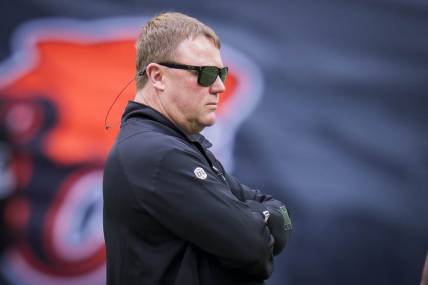 Jun 17, 2023; Vancouver, British Columbia, CAN; Edmonton Elks head coach and general manager Chris Jones watches his players during warm up prior to a game against the BC Lions at BC Place. Mandatory Credit: Bob Frid-USA TODAY Sports