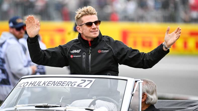 Jun 18, 2023; Montreal, Quebec, CAN; Haas F1 Team driver Nico Hulkenberg (GER) parades and salutes the crowd before the Canadian Grand Prix at Circuit Gilles Villeneuve. Mandatory Credit: David Kirouac-USA TODAY Sports