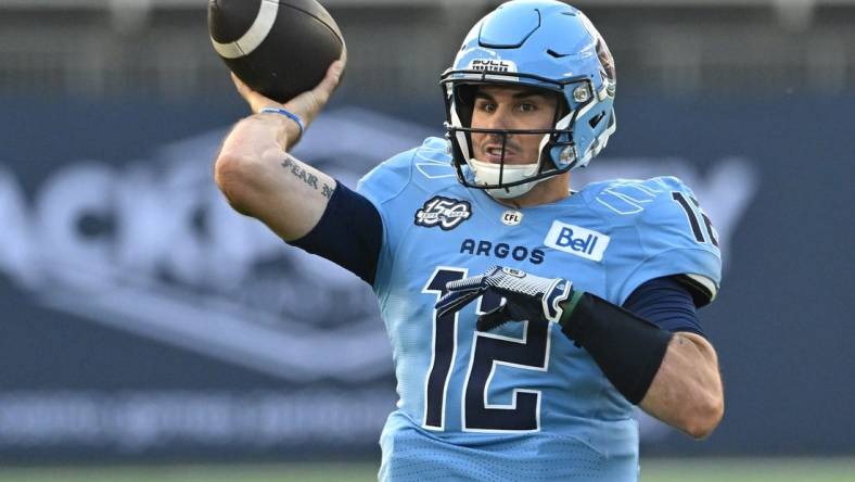 Jun 18, 2023; Toronto, Ontario, CAN;  Toronto Argonauts quarterback Chad Kelly (12) throws a pass against the Hamilton Tiger-Cats in the second quarter at BMO Field. Mandatory Credit: Dan Hamilton-USA TODAY Sports