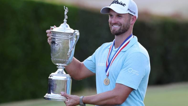 Jun 18, 2023; Los Angeles, California, USA; Wyndham Clark celebrates with the championship trophy after winning the U.S. Open golf tournament at Los Angeles Country Club. Mandatory Credit: Kiyoshi Mio-USA TODAY Sports