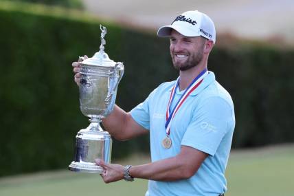 Jun 18, 2023; Los Angeles, California, USA; Wyndham Clark celebrates with the championship trophy after winning the U.S. Open golf tournament at Los Angeles Country Club. Mandatory Credit: Kiyoshi Mio-USA TODAY Sports