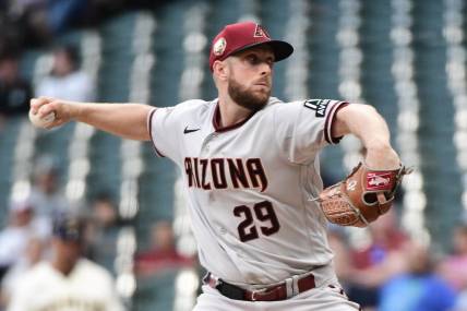 Jun 19, 2023; Milwaukee, Wisconsin, USA; Arizona Diamondbacks pitcher Merrill Kelly (29) pitches against the Milwaukee Brewers in the first inning at American Family Field. Mandatory Credit: Benny Sieu-USA TODAY Sports