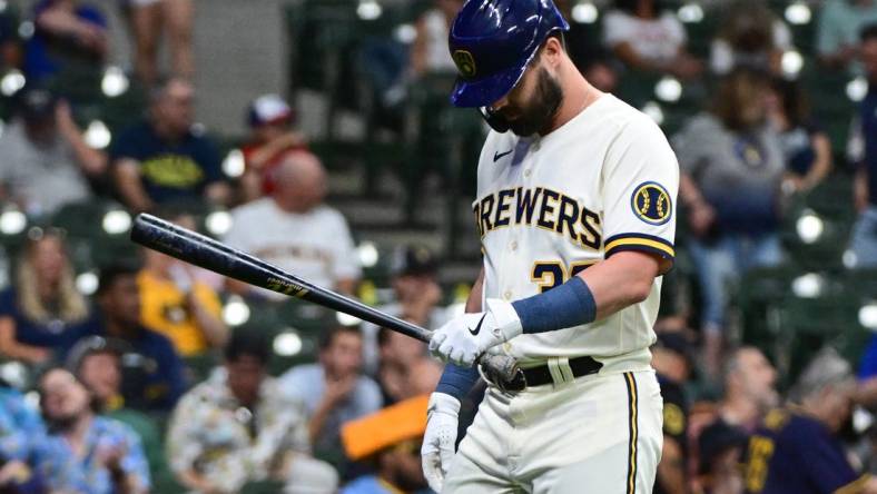 Jun 19, 2023; Milwaukee, Wisconsin, USA; Milwaukee Brewers designated hitter Jesse Winker (33) walks back to the dugout after striking out in the sixth inning against the Arizona Diamondbacks at American Family Field. Mandatory Credit: Benny Sieu-USA TODAY Sports