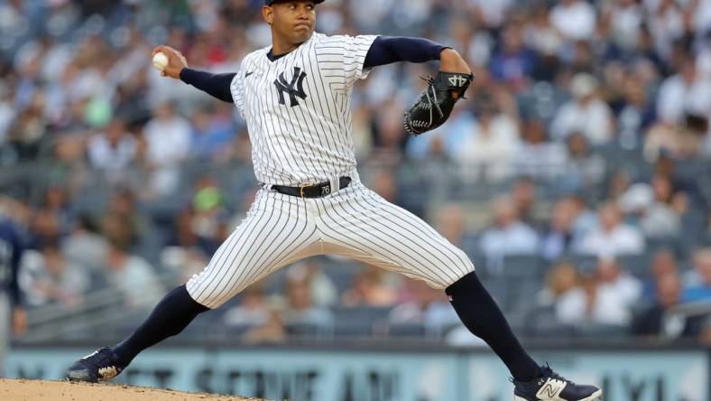 Jun 21, 2023; Bronx, New York, USA; New York Yankees starting pitcher Jhony Brito (76) pitches against Seattle Mariners during the second inning at Yankee Stadium. Mandatory Credit: Brad Penner-USA TODAY Sports