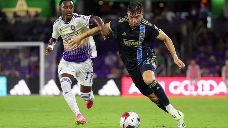 Jun 21, 2023; Orlando, Florida, USA;  Philadelphia Union defender Kai Wagner (27) controls the ball from Orlando City SC forward Ivan Angulo (77) in the second half at Exploria Stadium. Mandatory Credit: Nathan Ray Seebeck-USA TODAY Sports