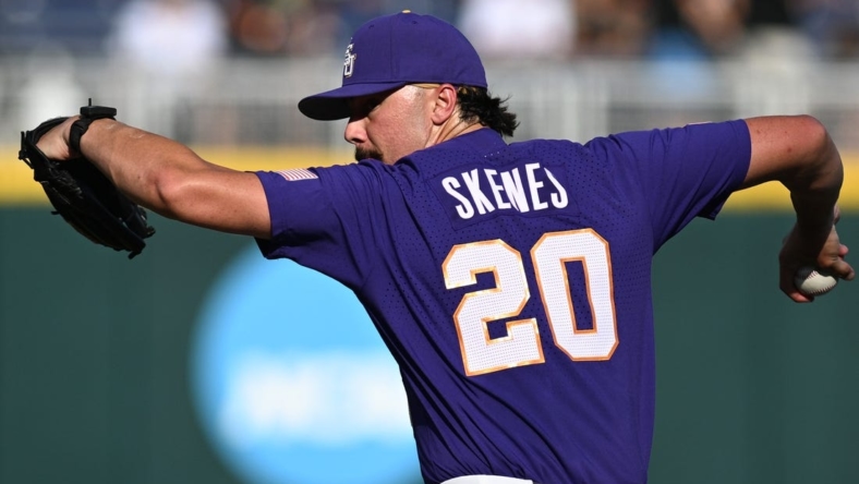 Jun 22, 2023; Omaha, NE, USA;  LSU Tigers starting pitcher Paul Skenes (20) throws against the Wake Forest Demon Deacons in the first inning at Charles Schwab Field Omaha. Mandatory Credit: Steven Branscombe-USA TODAY Sports