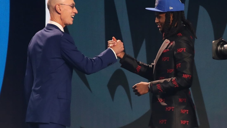 Jun 22, 2023; Brooklyn, NY, USA; Cason Wallace (Kentucky) is greeted by NBA commissioner Adam Silver after being selected tenth by the Dallas Mavericks in the first round of the 2023 NBA Draft at Barclays Arena. Mandatory Credit: Wendell Cruz-USA TODAY Sports