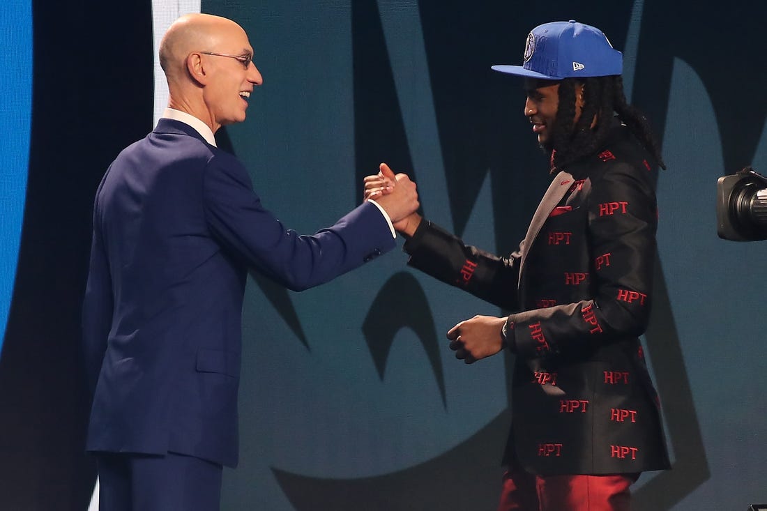 Jun 22, 2023; Brooklyn, NY, USA; Cason Wallace (Kentucky) is greeted by NBA commissioner Adam Silver after being selected tenth by the Dallas Mavericks in the first round of the 2023 NBA Draft at Barclays Arena. Mandatory Credit: Wendell Cruz-USA TODAY Sports