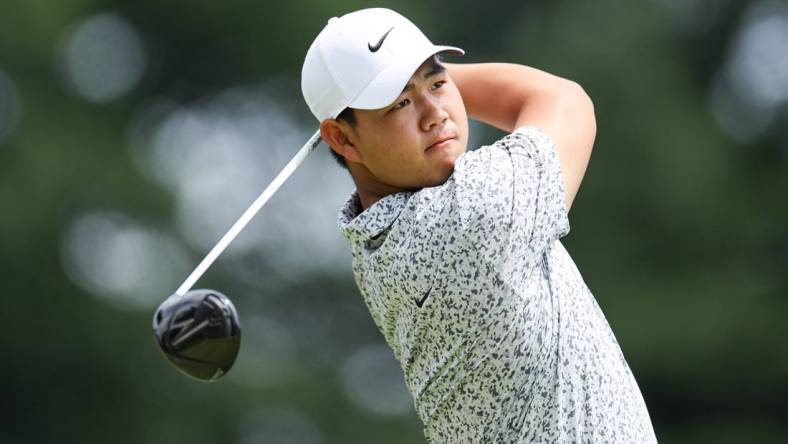 Jun 24, 2023; Cromwell, Connecticut, USA; Tom Kim plays his shot from the first tee during the third round of the Travelers Championship golf tournament. Mandatory Credit: Vincent Carchietta-USA TODAY Sports