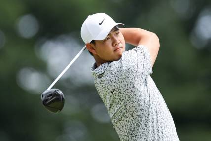 Jun 24, 2023; Cromwell, Connecticut, USA; Tom Kim plays his shot from the first tee during the third round of the Travelers Championship golf tournament. Mandatory Credit: Vincent Carchietta-USA TODAY Sports
