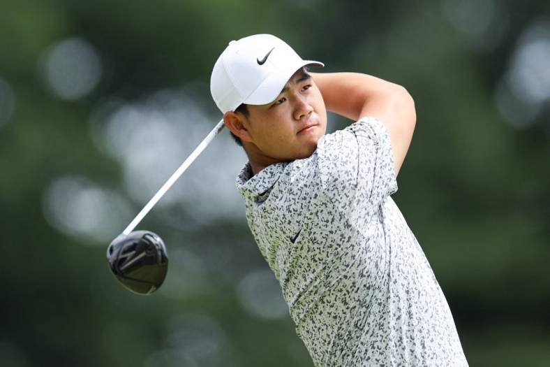 Jun 24, 2023; Cromwell, Connecticut, USA; Tom Kim plays his shot from the first tee during the third round of the Travelers Championship golf tournament. Mandatory Credit: Vincent Carchietta-USA TODAY Sports