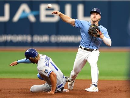 Jun 25, 2023; St. Petersburg, Florida, USA;  Tampa Bay Rays second baseman Taylor Walls (6) turns a double play against the Kansas City Royals in the second inning at Tropicana Field. Mandatory Credit: Nathan Ray Seebeck-USA TODAY Sports