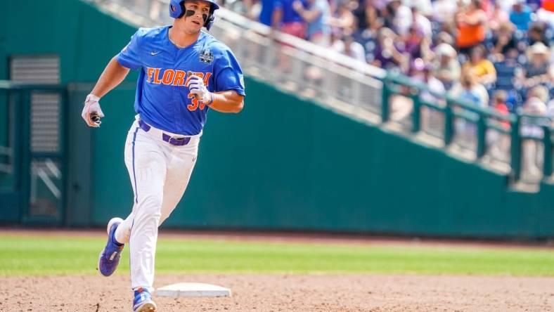 Jun 25, 2023; Omaha, NE, USA; Florida Gators center fielder Wyatt Langford (36) rounds the bases after hitting a three-run home run against the LSU Tigers during the sixth inning at Charles Schwab Field Omaha. Mandatory Credit: Dylan Widger-USA TODAY Sports