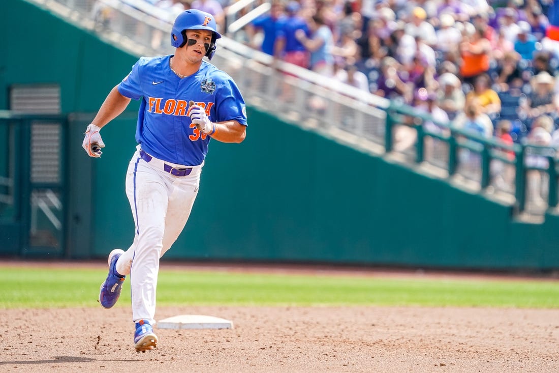 Jun 25, 2023; Omaha, NE, USA; Florida Gators center fielder Wyatt Langford (36) rounds the bases after hitting a three-run home run against the LSU Tigers during the sixth inning at Charles Schwab Field Omaha. Mandatory Credit: Dylan Widger-USA TODAY Sports