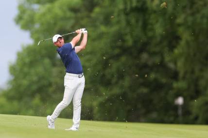 Jun 25, 2023; Cromwell, Connecticut, USA; Rory McIlroy plays his shot on the 14th hole during the final round of the Travelers Championship golf tournament. Mandatory Credit: Vincent Carchietta-USA TODAY Sports