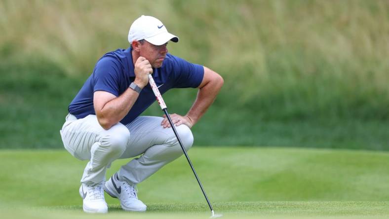 Jun 25, 2023; Cromwell, Connecticut, USA; Rory McIlroy looks over his putt on the 14th green during the final round of the Travelers Championship golf tournament. Mandatory Credit: Vincent Carchietta-USA TODAY Sports