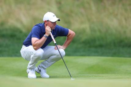 Jun 25, 2023; Cromwell, Connecticut, USA; Rory McIlroy looks over his putt on the 14th green during the final round of the Travelers Championship golf tournament. Mandatory Credit: Vincent Carchietta-USA TODAY Sports