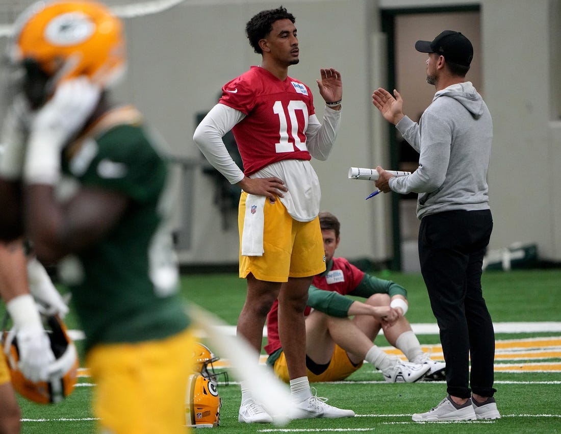 Green Bay Packers head coach Matt LaFleur talks with quarterback Jordan Love (10) during organized team activities Tuesday, May 23, 2023 in Green Bay, Wis.