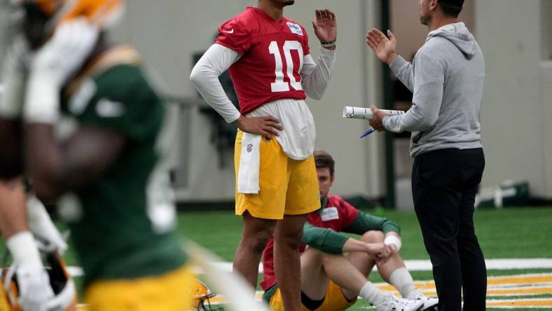 Green Bay Packers head coach Matt LaFleur talks with quarterback Jordan Love (10) during organized team activities Tuesday, May 23, 2023 in Green Bay, Wis.