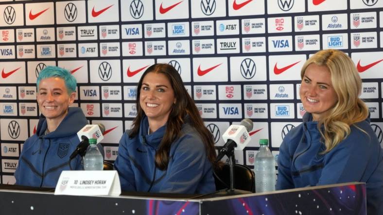 Jun 27, 2023; Carson, California, USA; USWNT forward Megan Rapinoe (left), forward Alex Morgan (center) and midfielder Lindsey Horan during Women's World Cup media day at Dignity Health Sports Park. Mandatory Credit: Kirby Lee-USA TODAY Sports