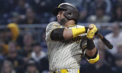 Jun 27, 2023; Pittsburgh, Pennsylvania, USA;  San Diego Padres designated hitter Nelson Cruz (32) hits a RBI single against the Pittsburgh Pirates during the sixth inning at PNC Park. Mandatory Credit: Charles LeClaire-USA TODAY Sports