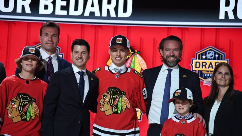 Jun 28, 2023; Nashville, Tennessee, USA; Chicago Blackhawks general manager Kyle Davidson congratulates first overall pick Connor Bedard during the 2023 NHL Draft at Bridgestone Arena. Mandatory Credit: Christopher Hanewinckel-USA TODAY Sports