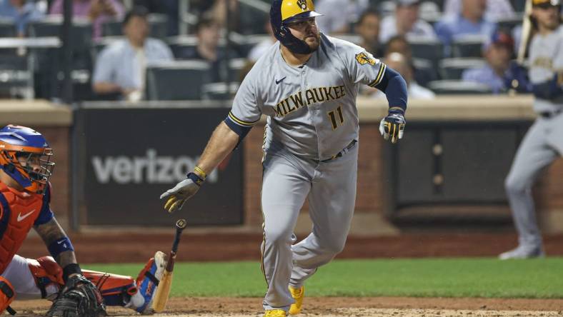 Jun 29, 2023; New York City, New York, USA; Milwaukee Brewers first baseman Rowdy Tellez (11) singles during the sixth inning against the New York Mets at Citi Field. Mandatory Credit: Vincent Carchietta-USA TODAY Sports