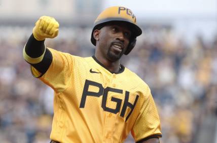 Jun 30, 2023; Pittsburgh, Pennsylvania, USA;  Pittsburgh Pirates designated hitter Andrew McCutchen (22) reacts as he circles the bases on a solo home run against the Milwaukee Brewers during the fourth inning at PNC Park. Mandatory Credit: Charles LeClaire-USA TODAY Sports