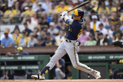 Jul 1, 2023; Pittsburgh, Pennsylvania, USA; Milwaukee Brewers left fielder Christian Yelich (22) hits a three-run home run during the second inning against the Pittsburgh Pirates at PNC Park. Mandatory Credit: Scott Galvin-USA TODAY Sports