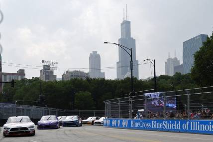 Jul 1, 2023; Chicago, Illinois, USA; Xfinity Series driver Cole Custer (00) leads the field along Grant Park during The Loop 121 of the Chicago Street Race. Mandatory Credit: Mike Dinovo-USA TODAY Sports