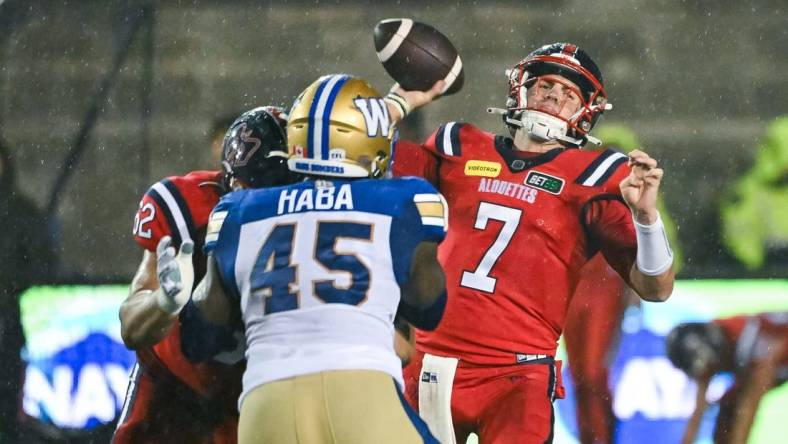 Jul 1, 2023; Montreal, Quebec, CAN; Montreal Alouettes quarterback Cody Fajardo (7) passes the ball against the Winnipeg Blue Bombers during the third quarter at Percival Molson Memorial Stadium. Mandatory Credit: David Kirouac-USA TODAY Sports